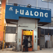Safety protection device in the working area of refractory press
